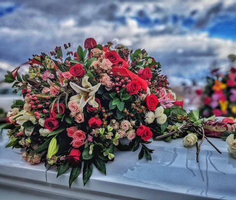 A bunch of flowers sitting on top of a car